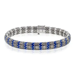 This 14k white gold and titanium men's bracelet features accents of blue enamel within its python-like pattern.